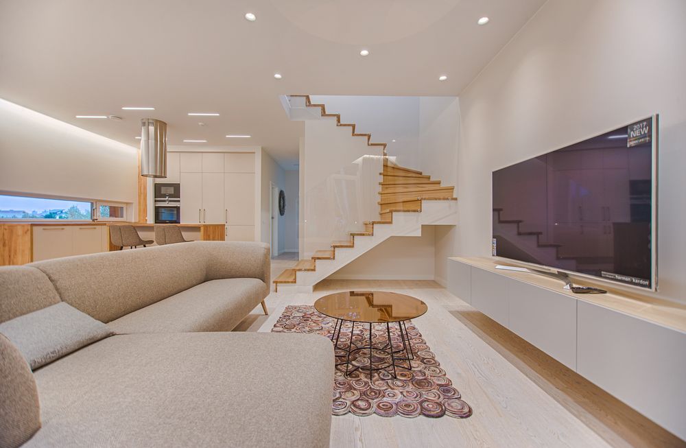 Turned-on grey flat-screen smart TV in a modern living room