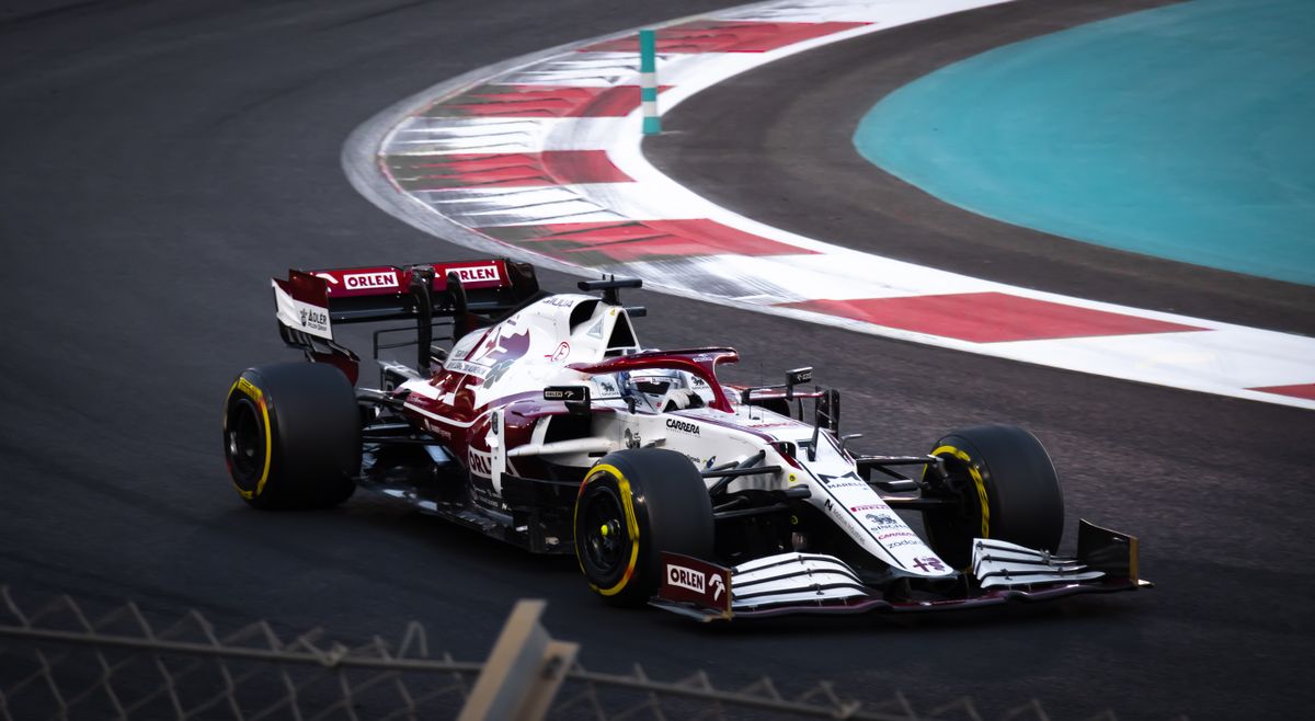 Formula 1 car cornering at speed on a race circuit